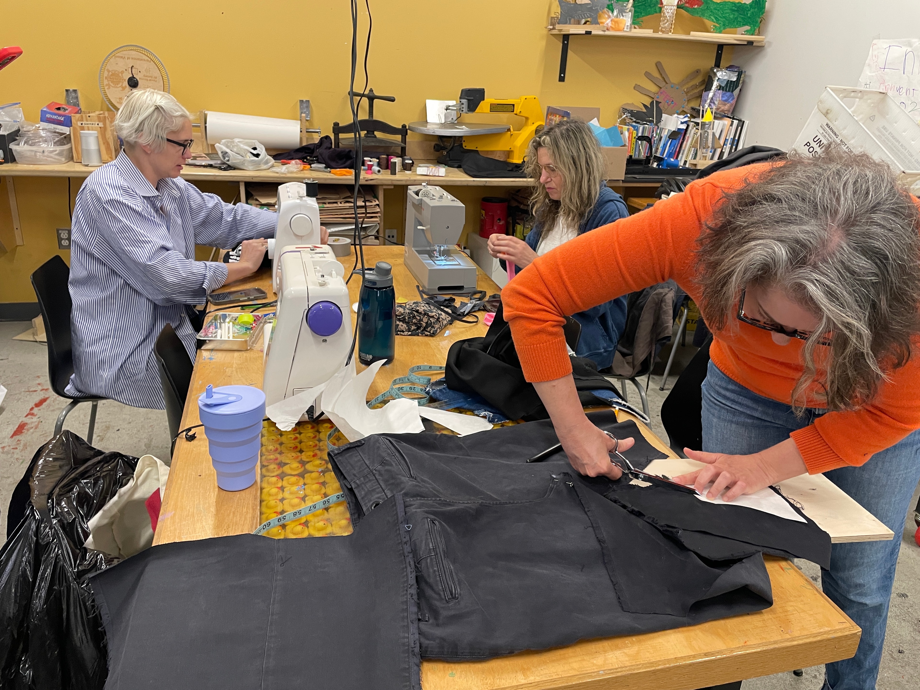 People sewing and crafting in workshop
